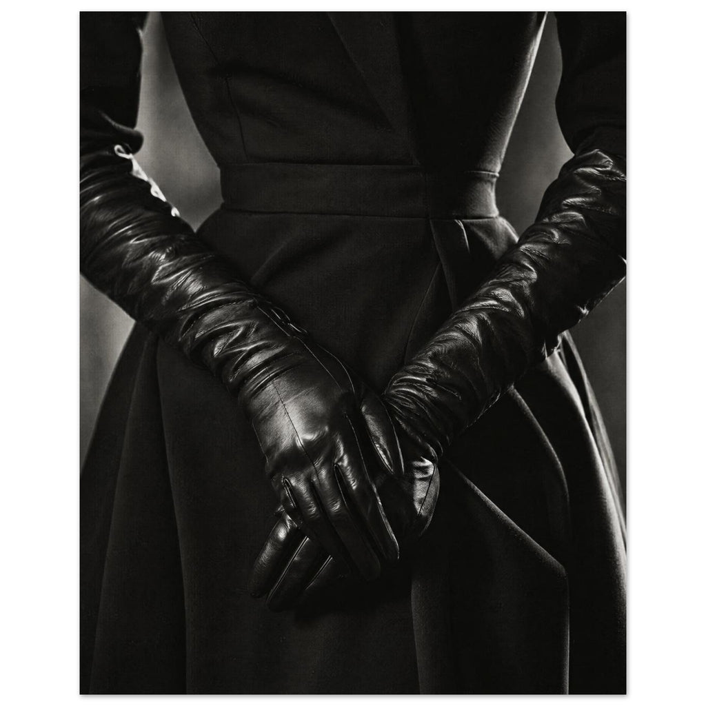 Overlapping hands in long black leather gloves against a dark fitted outfit, photographed in black and white.
