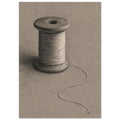 Wooden spool wrapped in pale thread, with a loose strand curling across a textured taupe background.