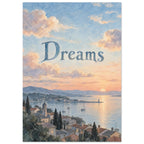 Dreams lettering over a watercolour coastal sunset with peach clouds, blue water, sailboats and a village of tiled roofs.