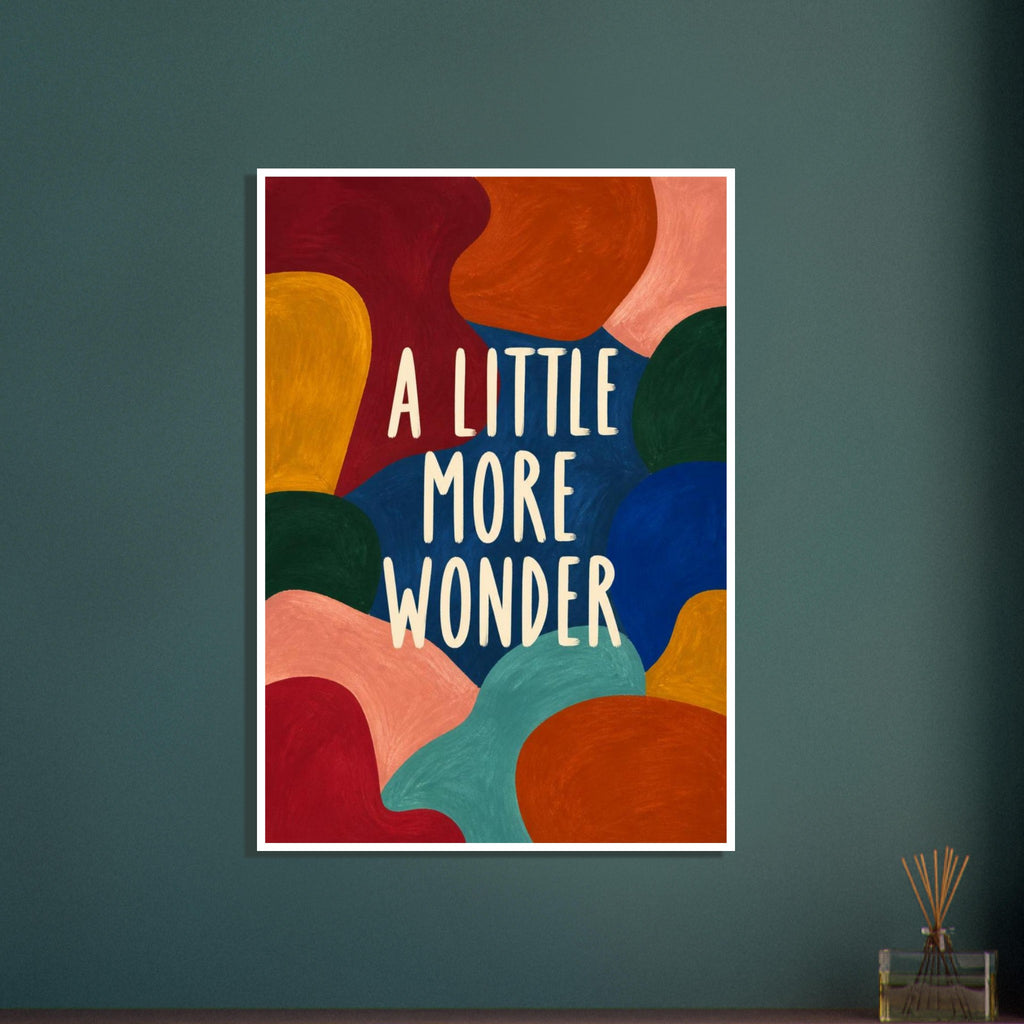 Cream lettering reading “A Little More Wonder” surrounded by textured abstract shapes in rich and bright colours.