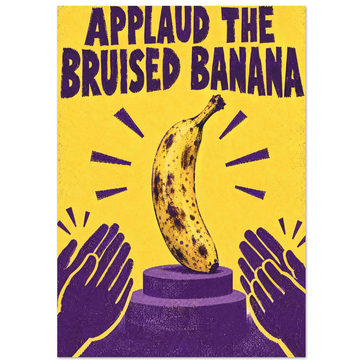 Bruised banana on a purple podium with clapping hands, a yellow background and the words ‘Applaud the Bruised Banana’.