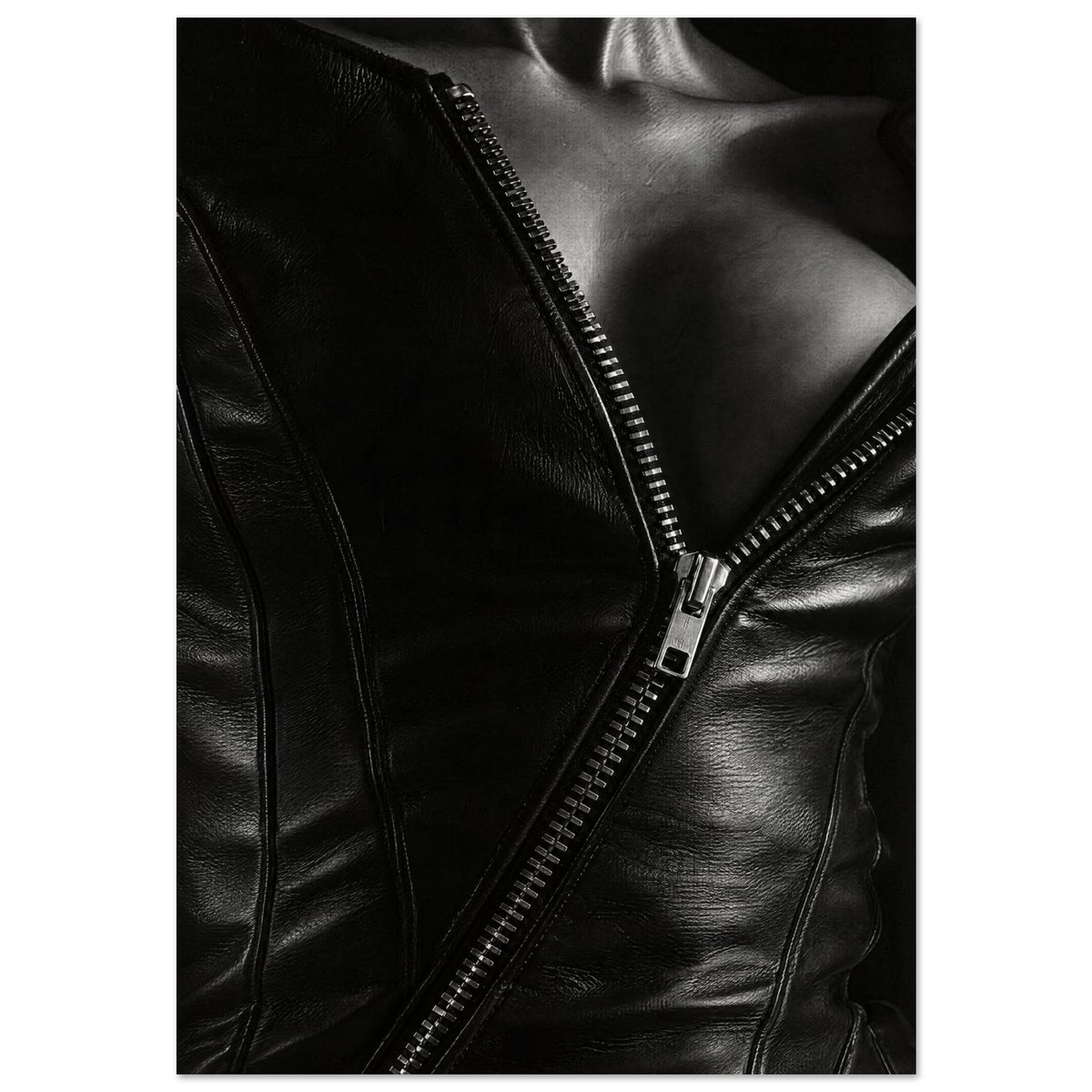 Black and white close-up of an open leather jacket with a diagonal metal zip and an exposed neckline.