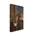 Large brass-toned telescope in an observatory, with a figure studying a chart beneath a blue sky and crescent moon.
