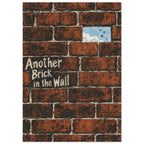 Rust-red brick wall with cream Another Brick in the Wall lettering and a gap revealing blue sky and flying birds.