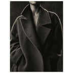 The Oversized Lapel, a chin-to-hip photograph of a model in a wool coat with a brightly outlined shoulder against charcoal sh