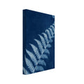 Pale blue fern frond with a curled tip extending diagonally across a textured deep blue background.