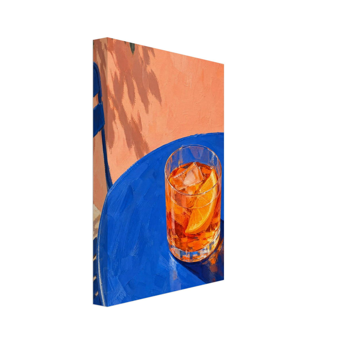 Orange cocktail with ice and an orange slice on a blue table, beside a blue chair and peach wall with leafy shadows.