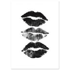 Three black and grey lip impressions stacked vertically on a white background, with textured edges and visible creases.