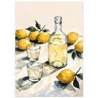 Yellow lemons with green leaves surround a clear bottle and two glasses of pale yellow liquid on a cream tabletop.