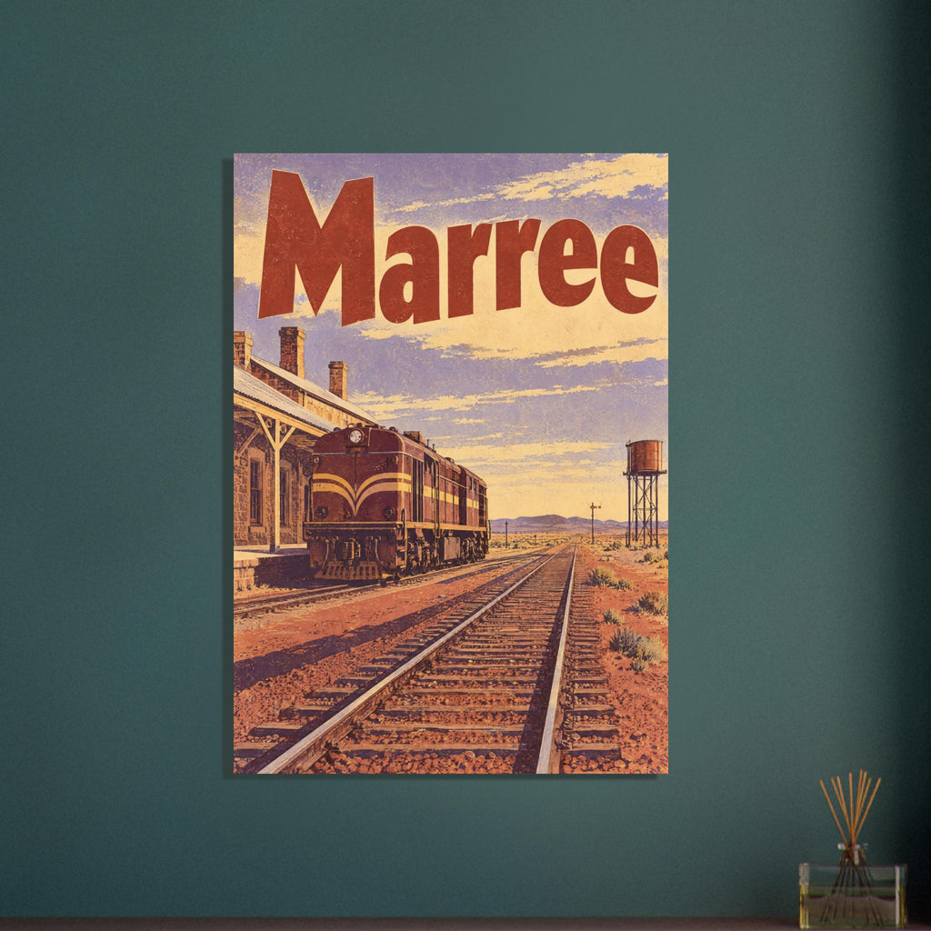 Marree lettering above a locomotive beside a station, with railway tracks crossing a desert landscape and a water tank.