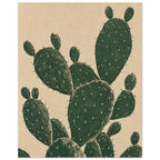 Prickly pear cactus with overlapping dark green oval pads, fine pale markings and spines against a textured beige background.