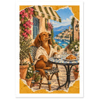 Dachshund in a white shirt at a café table with coffee and a croissant, overlooking a blue bay within a yellow border.