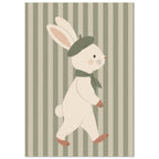 Cream bunny wearing a green beret and scarf, walking against muted green and beige vertical stripes.
