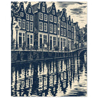 Gabled canal houses in navy and cream, with a street lamp, bicycles, an arched bridge and rippling reflections.