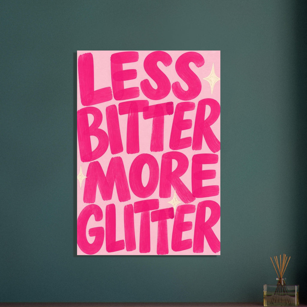 Less Bitter More Glitter in oversized hot pink brush-style lettering on a blush pink background with cream starbursts.