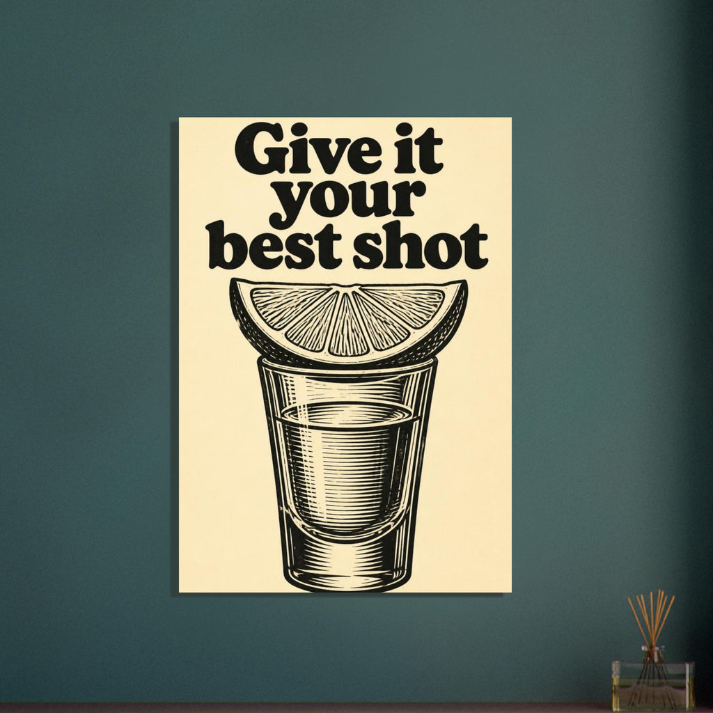 Black “Give it your best shot” lettering above a citrus wedge resting on a shot glass, on a warm cream background.