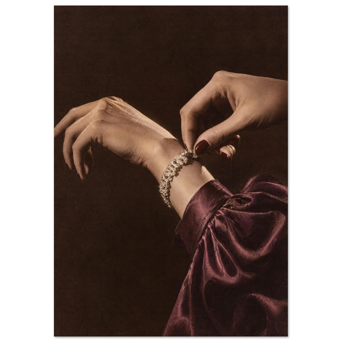 Hands adjusting a sparkling bracelet, with dark red nails and a gathered burgundy sleeve against a dark brown background.