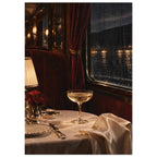 Train dining table with a coupe glass, glowing lamp and cream linen beside burgundy seating and a rain-streaked window.