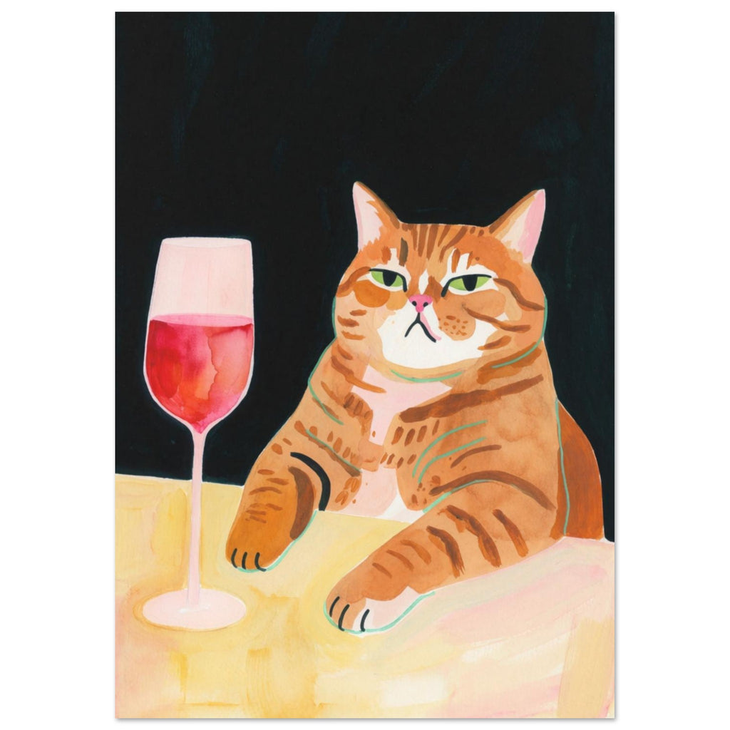 Ginger tabby with green eyes resting its paws on a yellow table beside a glass of pink-red wine against a dark background.