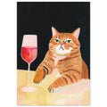 Ginger tabby with green eyes resting its paws on a yellow table beside a glass of pink-red wine against a dark background.