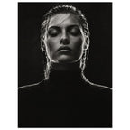 Black and white portrait of a woman with closed eyes, slicked-back hair and a dark high-neck top against black.