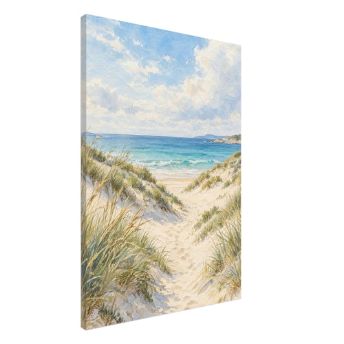 Sand dunes with grasses and footprints leading to turquoise waves beneath a blue sky with soft white clouds.