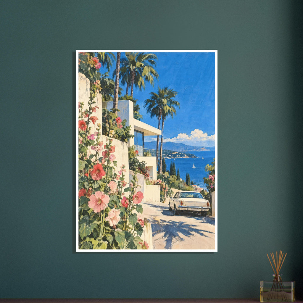 Pink hollyhocks beside a cream villa, with palm trees, a vintage car and a blue sea backed by distant mountains.