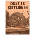 Smiling dust creature beside books and dried stems, with a tiny welcome mat and ‘Dust Is Settling In’ text above.