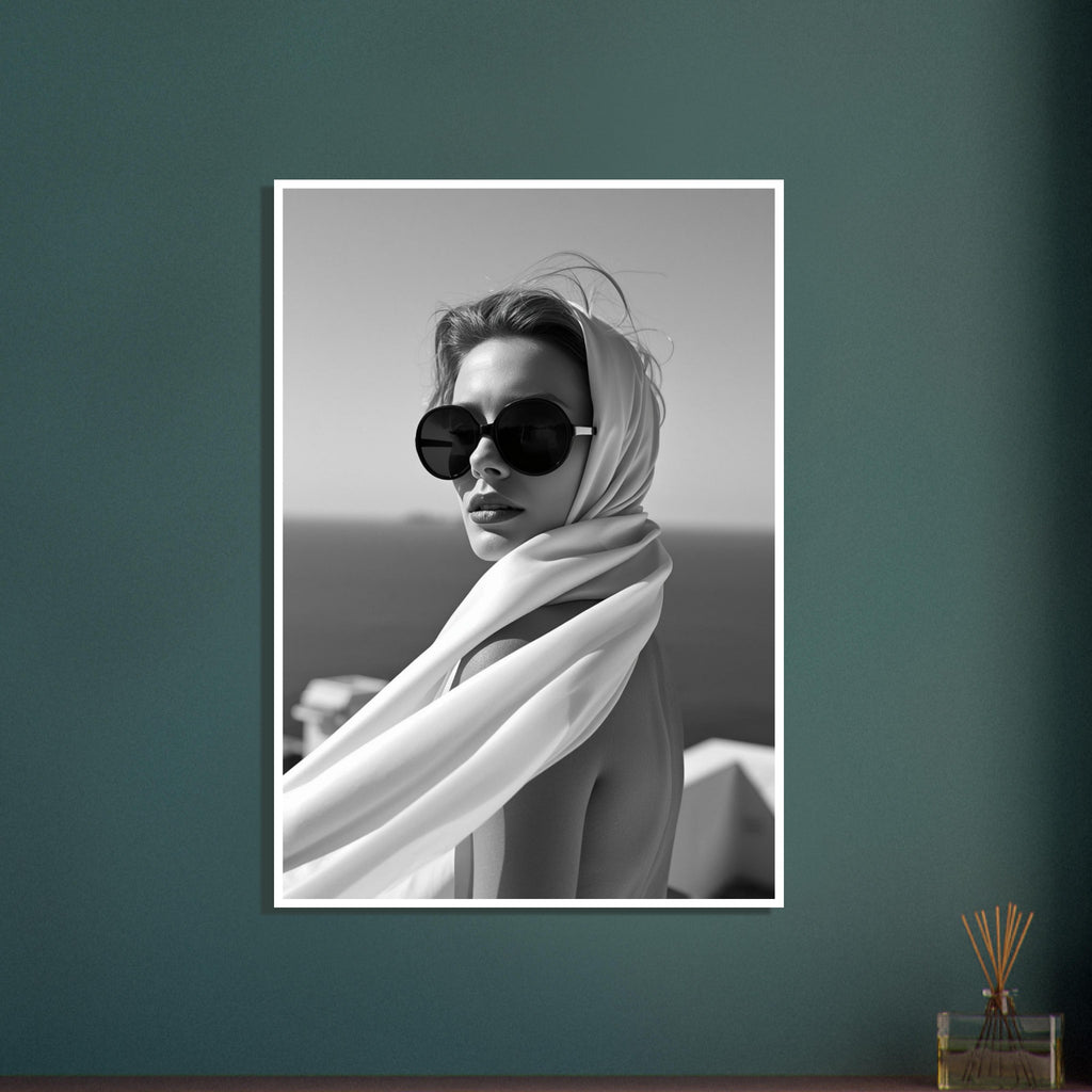 Woman wearing oversized round sunglasses and a light flowing headscarf, photographed in black and white.