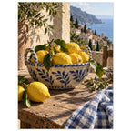Lemons in a blue-and-white bowl on a wooden table, with olive branches, checked cloth and a coastal village beyond.