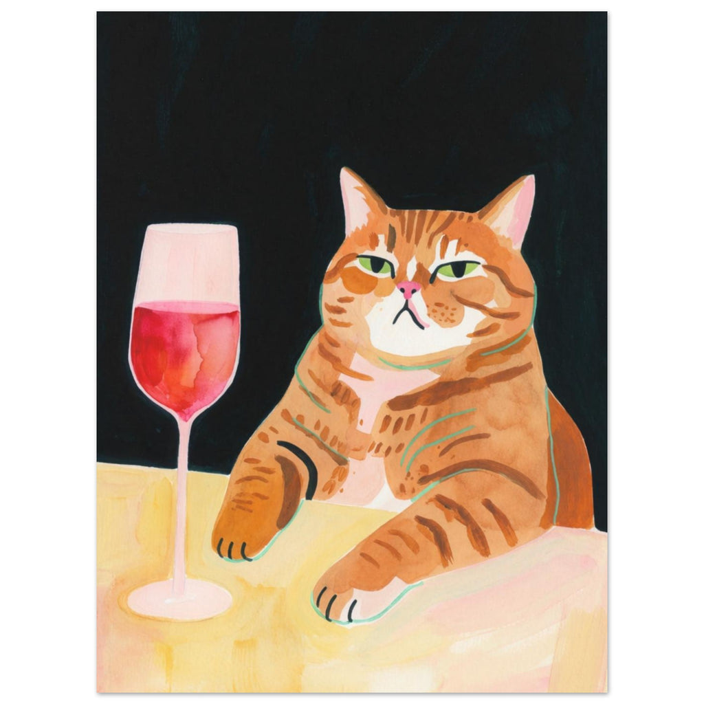 Ginger tabby with green eyes resting its paws on a yellow table beside a glass of pink-red wine against a dark background.