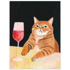 Ginger tabby with green eyes resting its paws on a yellow table beside a glass of pink-red wine against a dark background.