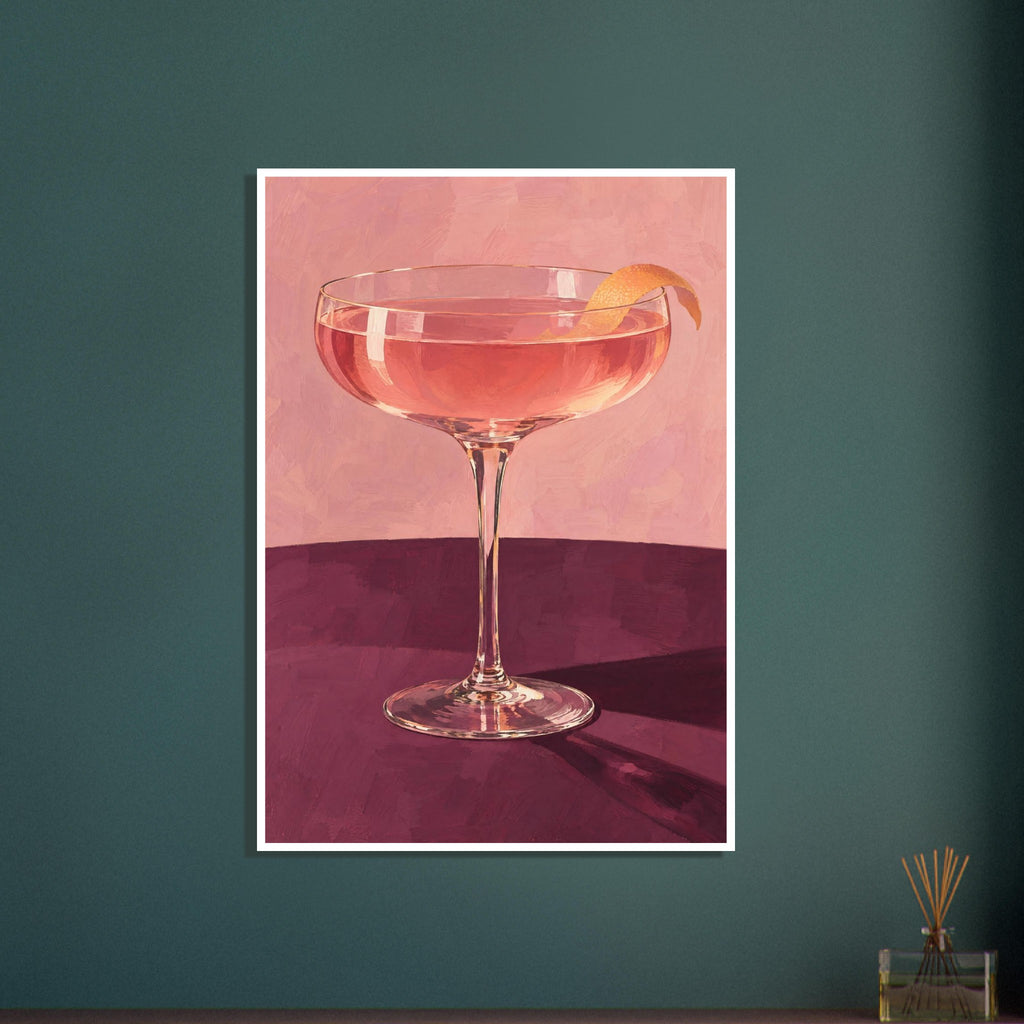 Coupe glass holding a pink cocktail with orange peel on a burgundy table against a textured pink background.