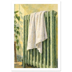 White towel draped over a green ribbed radiator against a yellow wall, with a leafy plant and soft shadows.