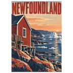 Newfoundland lettering above a red waterfront building, rocky shore and blue sea with icebergs beneath a peach sky.