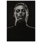 Black and white portrait of a woman with closed eyes, slicked-back hair and a dark high-neck top against black.