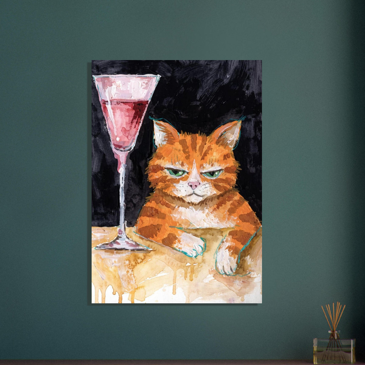 Ginger cat with green eyes resting its white paws on a golden table beside a tall glass of pink liquid, on black.