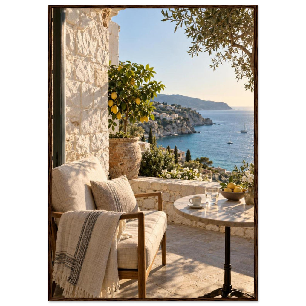 Lemon tree on a stone terrace with a cushioned chair, round table and blue sea overlooking a rocky coastline.