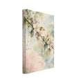 Flowering branch with pale pink and white blossom and green leaves against soft cream, blue and pink watercolour washes.