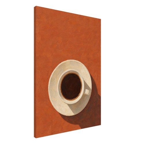 Cream cup filled with dark coffee on a saucer, viewed from above against terracotta orange with a long brown shadow.