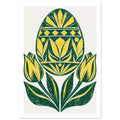 Yellow and green patterned Easter egg above two yellow tulips and sweeping green leaves on a cream background.