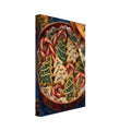 Open tin of iced Christmas tree biscuits and candy canes, with a candle, holly, pine cone and gold star on blue.