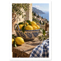 Lemons in a blue-and-cream ceramic bowl on a rustic table, with olive branches, checked cloth and a coastal view.