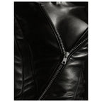 Black and white close-up of an open leather jacket with a diagonal metal zip and an exposed neckline.