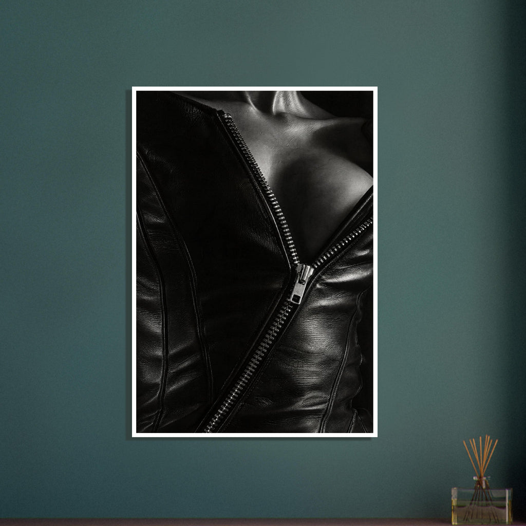 Black and white close-up of an open leather jacket with a diagonal metal zip and an exposed neckline.