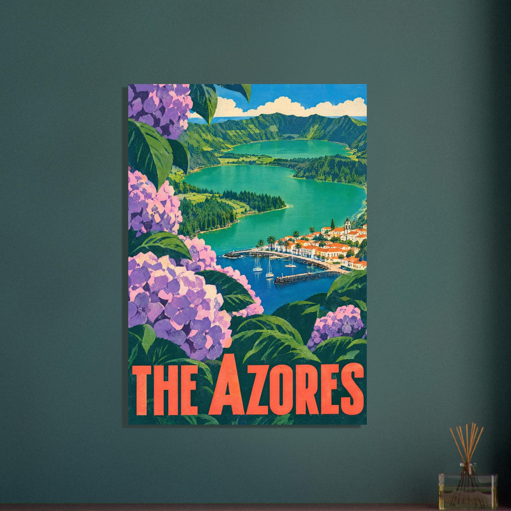 Pink and purple hydrangeas frame green lakes, mountain ridges and a village harbour above bold ‘The Azores’ lettering.