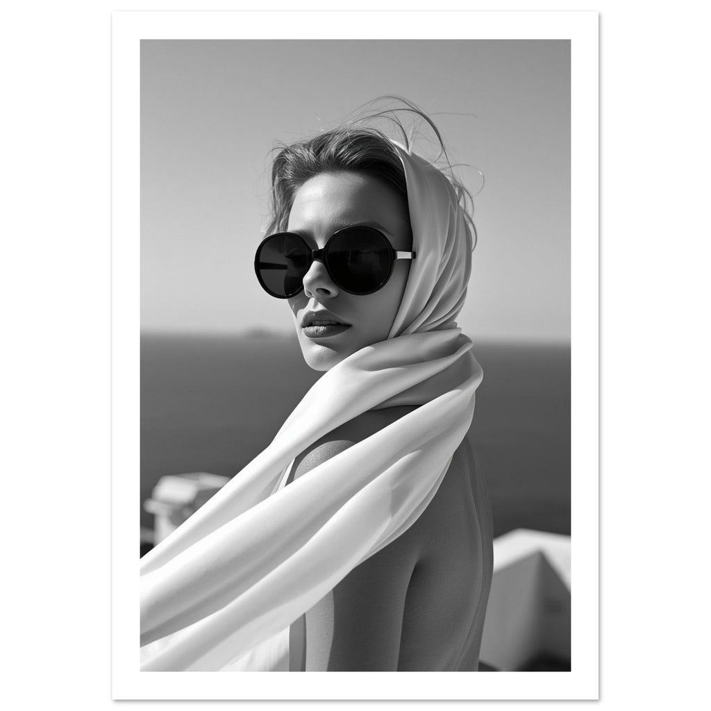 Woman wearing oversized round sunglasses and a light flowing headscarf, photographed in black and white.