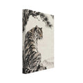 Tiger seated on a rocky ledge beneath a magpie on a pine branch, with pale mountains against a warm cream background.
