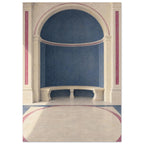 Blue arched alcove with a curved cream stone bench, classical columns and rose-coloured borders across the floor.