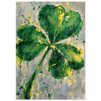 Four leaf clover painted in layered greens with yellow splashes and paint drips on a mottled grey and cream background.